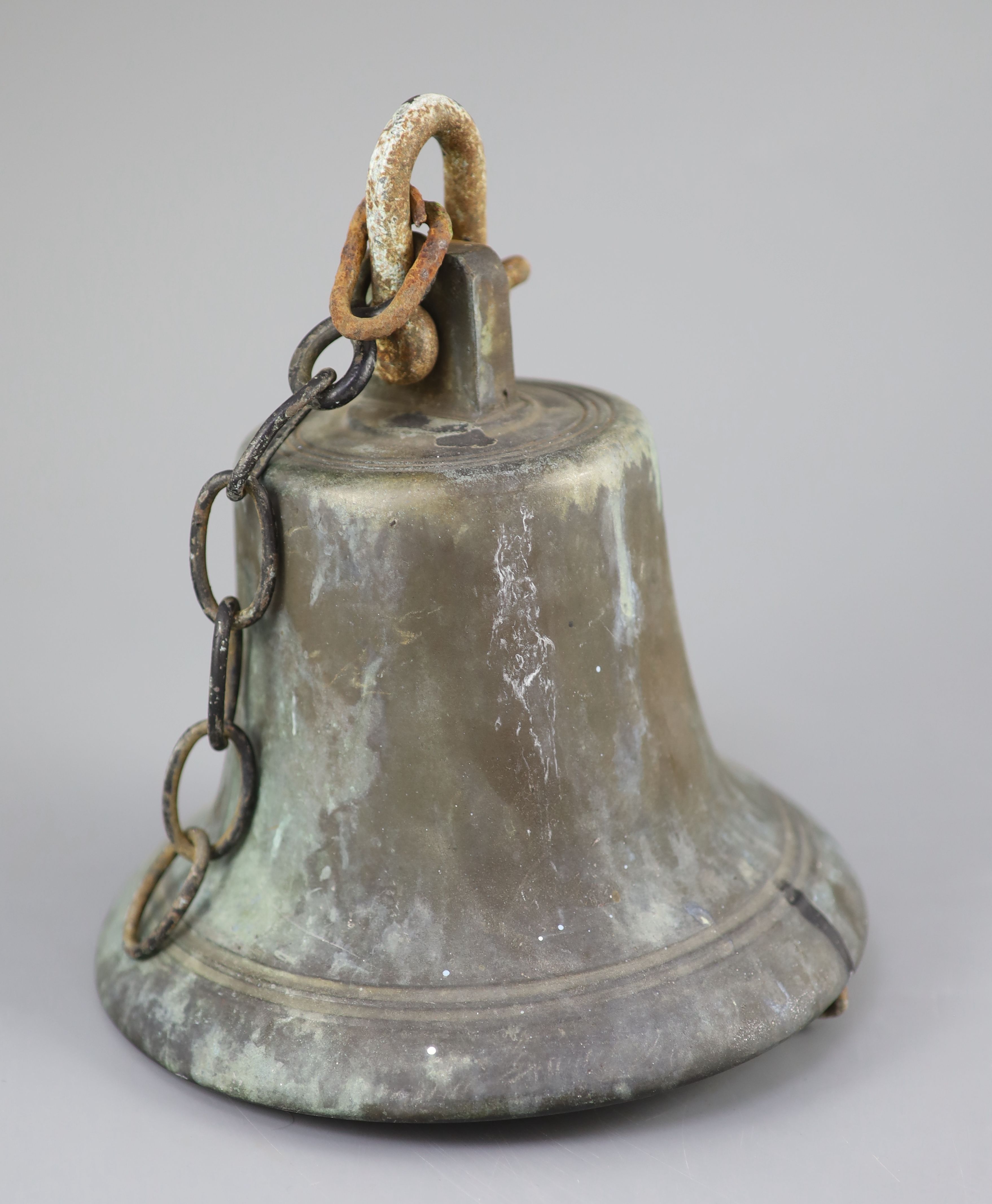 A bronze ships bell from the 1914 HMS Ark Royal, retaining its original clanger, height 8.25in. diameter 8.25in.